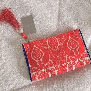 Jasper & Jeera clutch from Anthropologie. Hot pink with tassel. Never used.
